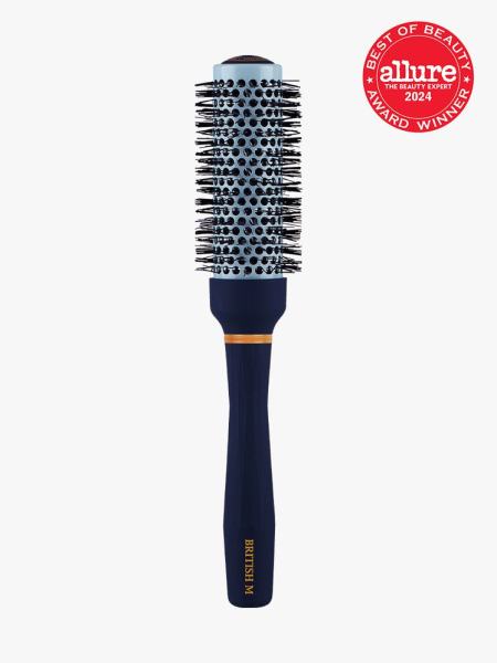 ceramic brush in navy and gold color way on light gray background with red and white 2024 allure best of beauty seal